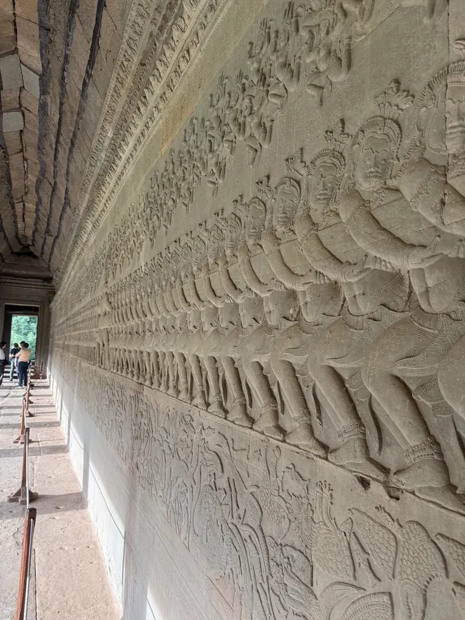 The Churning of the Sea of Milk relief, Angkor Wat — the guide walked the length of it
